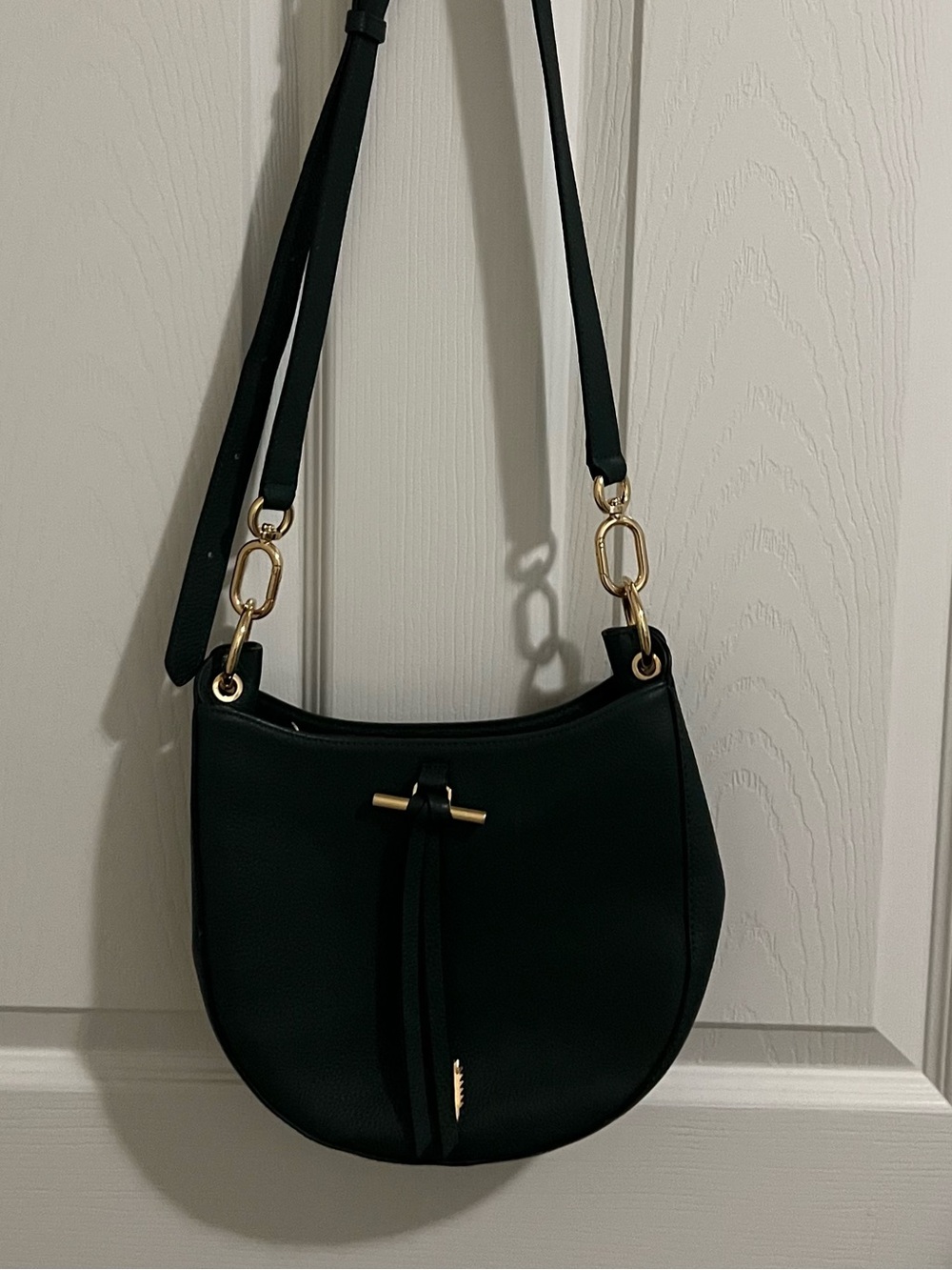 Minimalist Black Crescent Crossbody Bag with Gold Accents